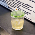 Vertical Ribbed Glass Tumbler With Green Lid And Daisy Straw Topper