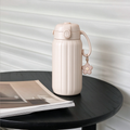 Beige Ribbed Flower Charm Water Bottle